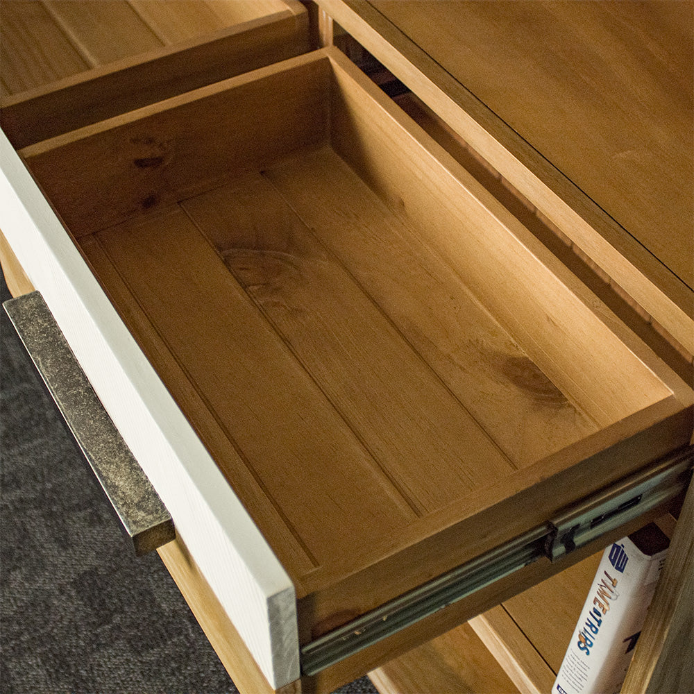 An overall view of the drawers in the middle of the Soho Medium Bookcase.