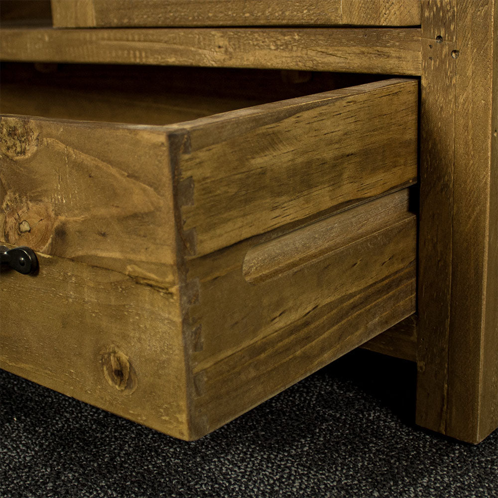 The side of the drawer for the Ventura Recycled Pine Display Cabinet, showing the dovetail joinery and smooth freestanding runners.