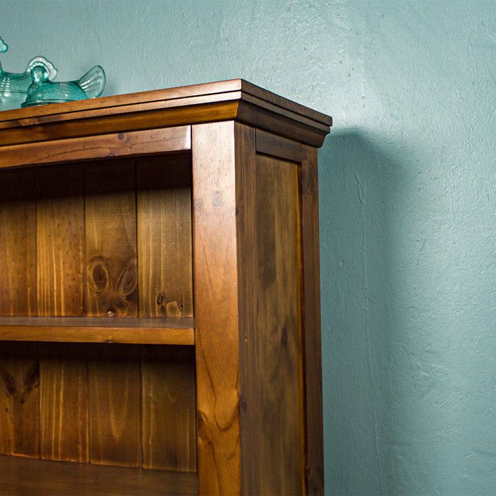 The side of the Montreal Short Pine Bookcase.