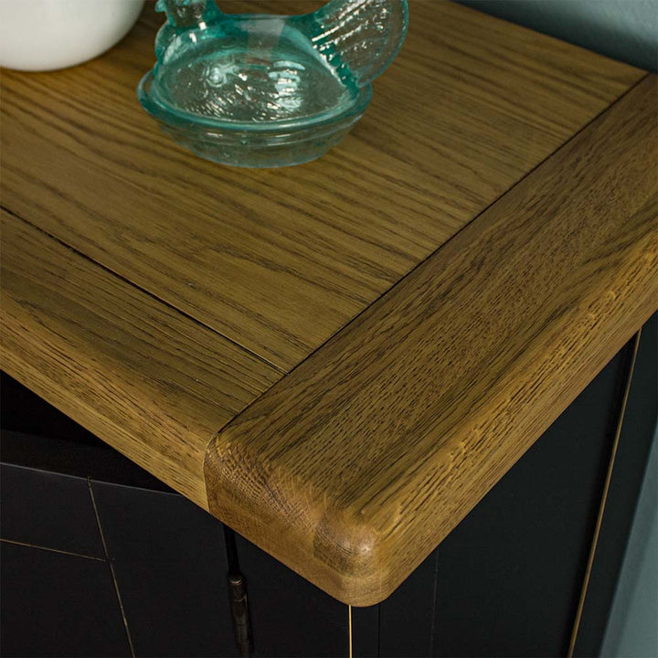 A close up of the top of the Cascais Oak-Top Small Sideboard, showing the wood grain and colour.