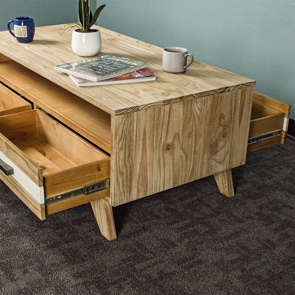 A view of the side of the Soho 4 Drawer NZ Pine Coffee Table, showing the drawers on the other side of the unit.
