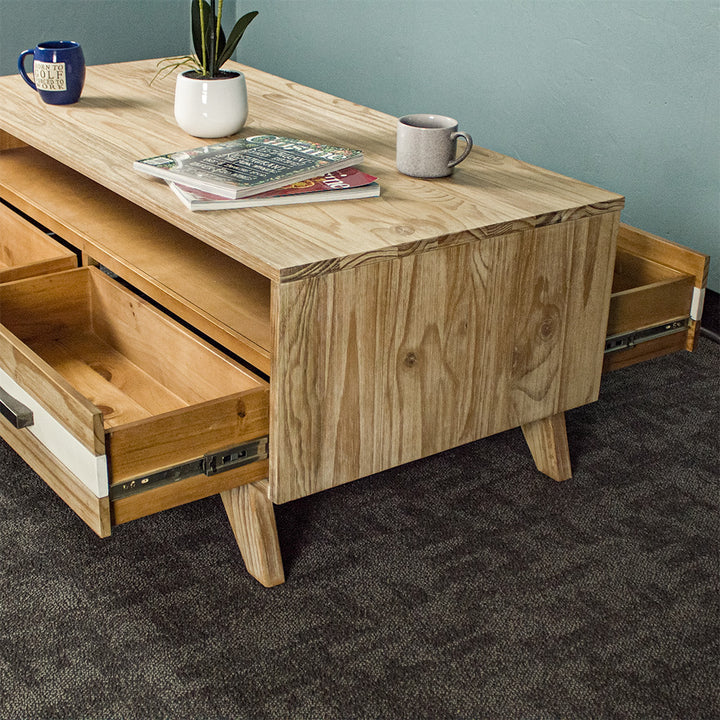 A view of the side of the Soho 4 Drawer NZ Pine Coffee Table, showing the drawers on the other side of the unit.
