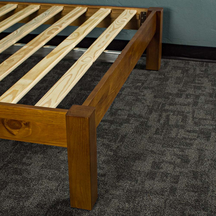 The footboard of the Trent Queen Size NZ Pine Slat Bed Frame.