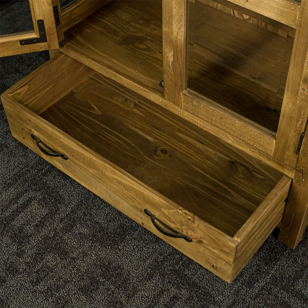 An overall view of the wide drawer for the Ventura Recycled Pine Display Cabinet