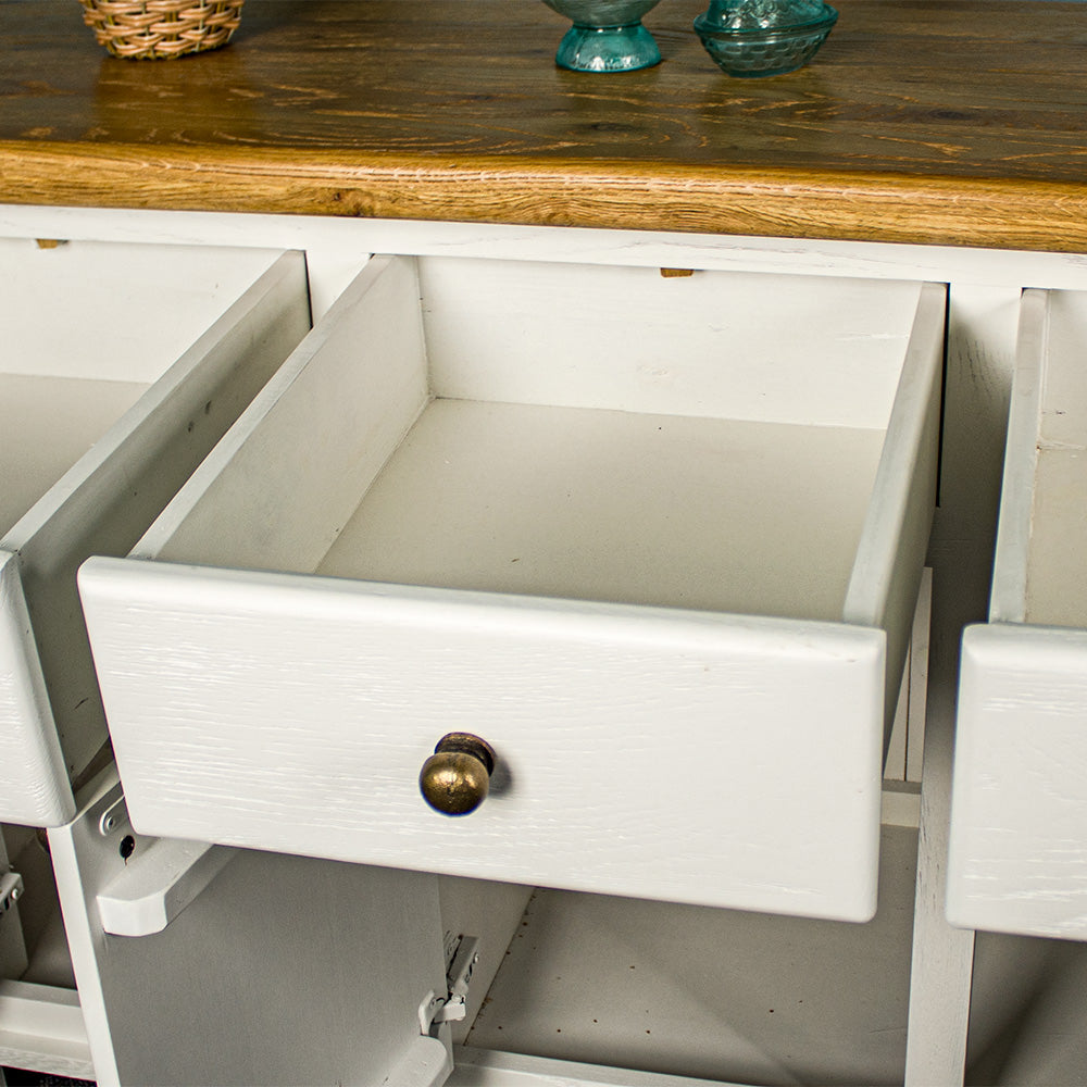 An overall view of the drawers on the Loire Two-Tone Medium Oak Buffet.