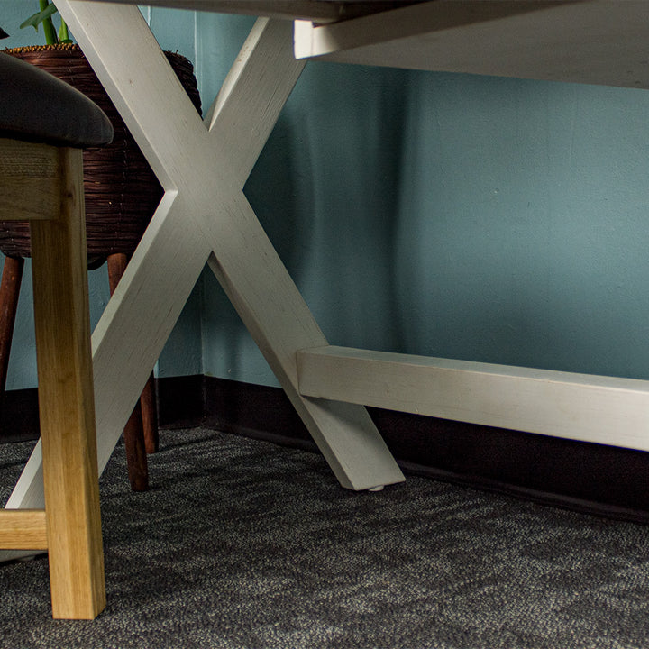 A view of the wooden support bar under the Byron Recycled Pine Desk.