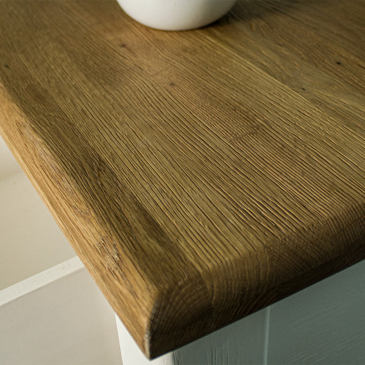 A close up of the top of the Loire Oak Console Table, showing the wood grain and colour.