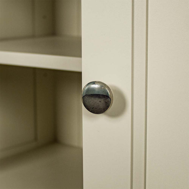 A close up of the chrome/silver metal handle on the doors of the Alton 2 Door 2 Drawer NZ Pine Buffet