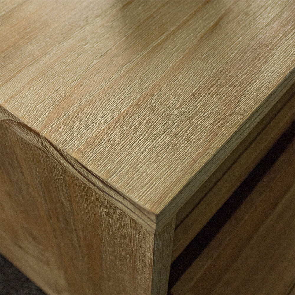 A close up of the top of the Soho 4 Drawer NZ Pine Coffee Table, showing the wood grain and colour.