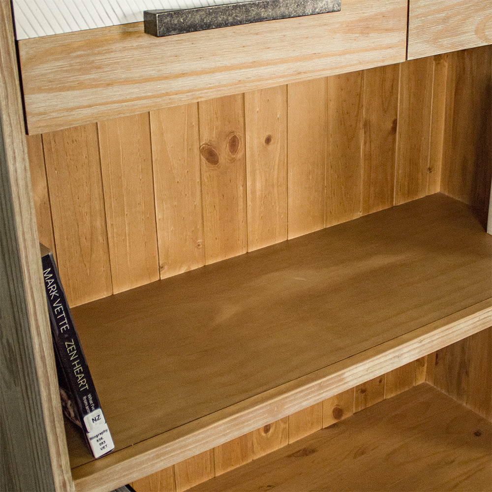 A view of the shelving below the drawers on the Soho Tall Bookcase.