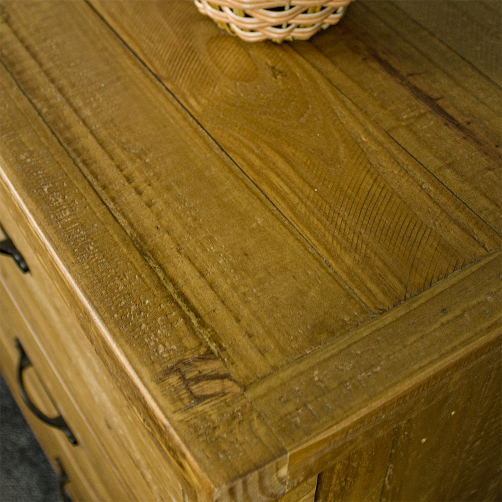 A close up of the top of the Ventura Recycled Pine Lowboy, showing the wood grain and colour.