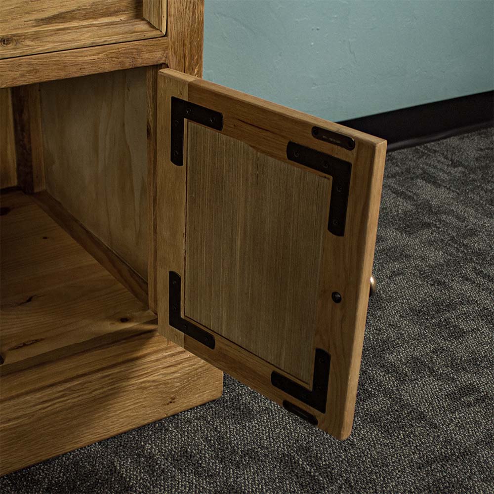 A closer view of the inside of the door of the Versailles Large Oak Buffet, showing the magnets which keep it closed when it needs to be.