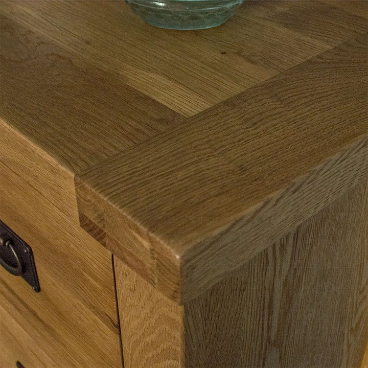 A close up of the top of the Yes Compact 1 Door 3 Drawer Oak Buffet, showing the wood grain and colour.