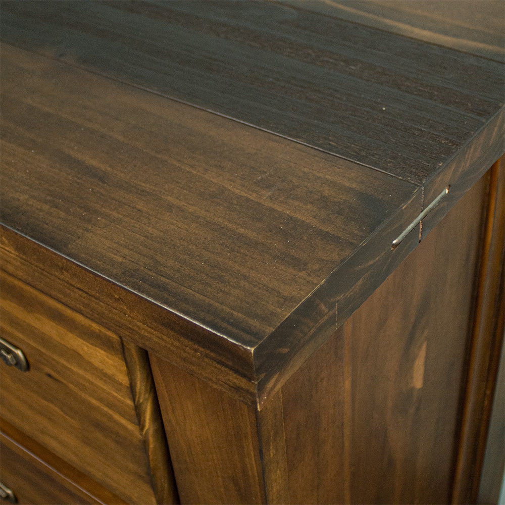 A close up of the top of the Botanica Large Seven Drawer Lowboy, showing the wood grain and colour.