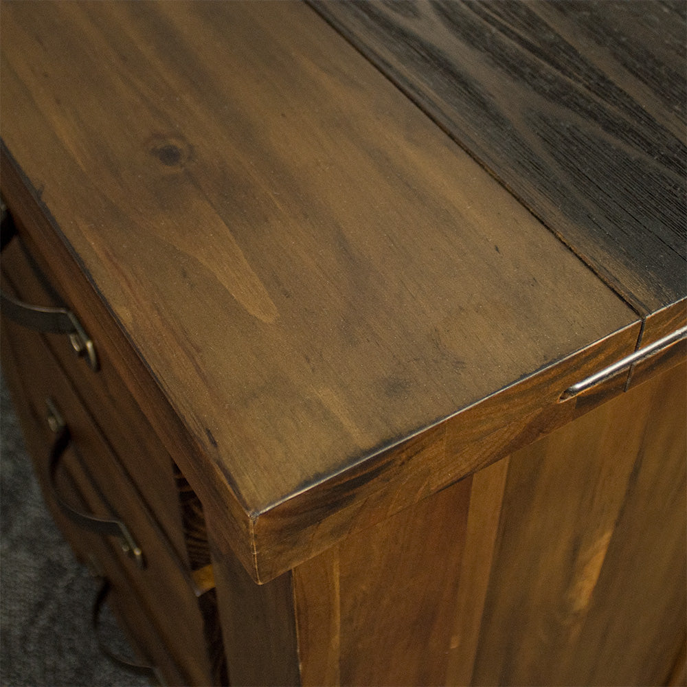 A close up of the top of the Botanica Bedside Cabinet, showing the wood grain and colour as well as the stapled design.