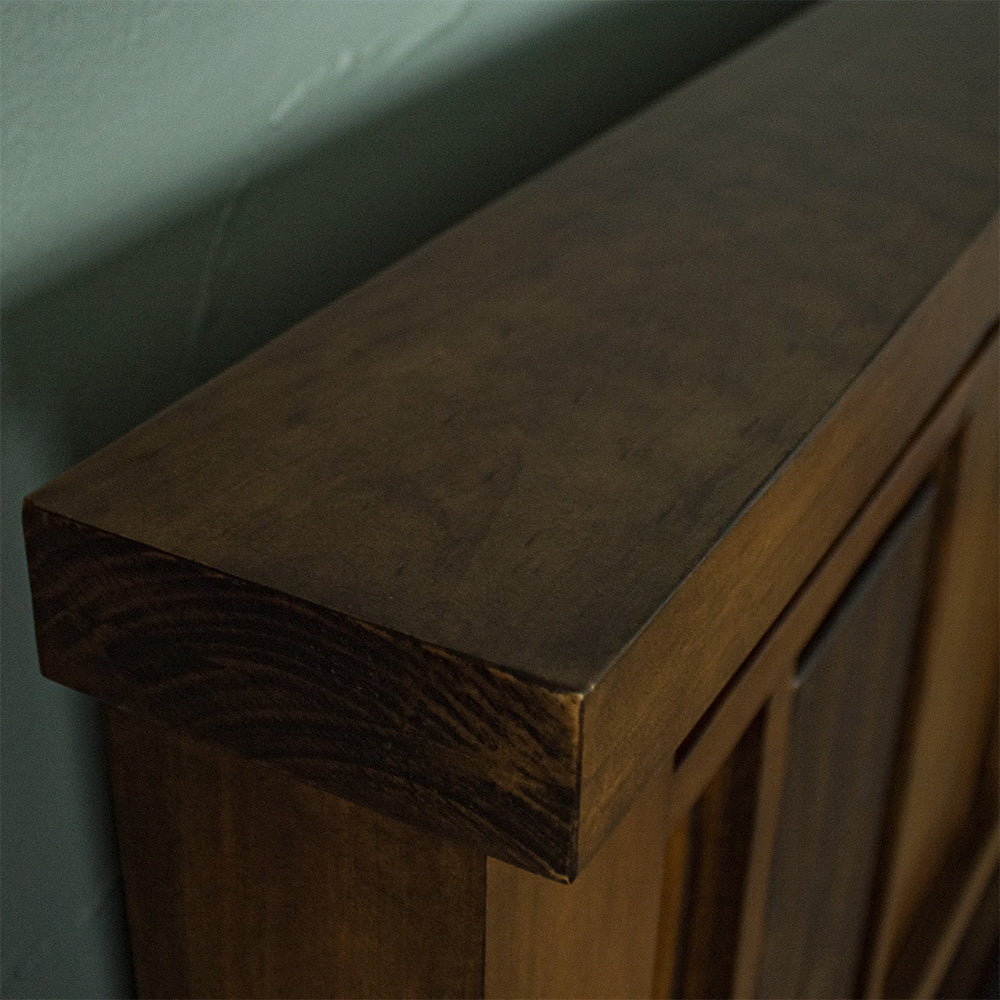 A close up of the top of the Botanica Queen Slat Bed Frame, showing the wood grain and colour.