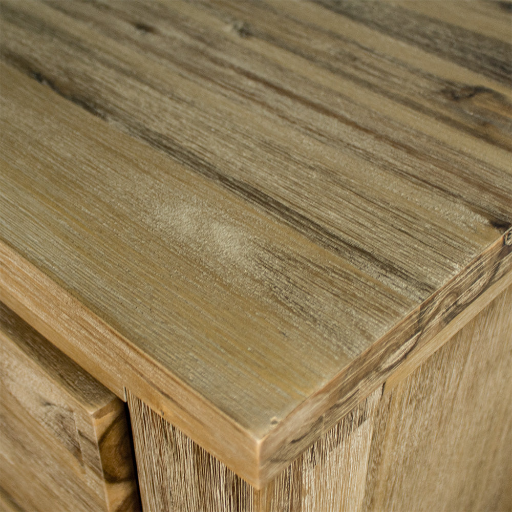 A close up of the top of the Mars Four Drawer Tallboy, showing the wood grain and colour.