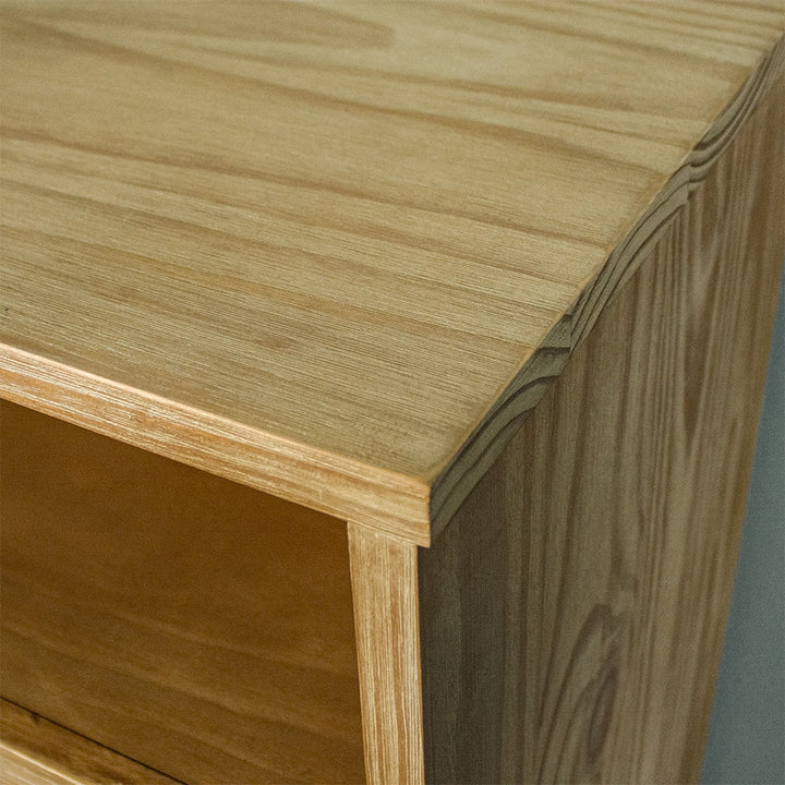 A close up of the top of the Soho Short Display Shelf, showing the wood grain and colour.