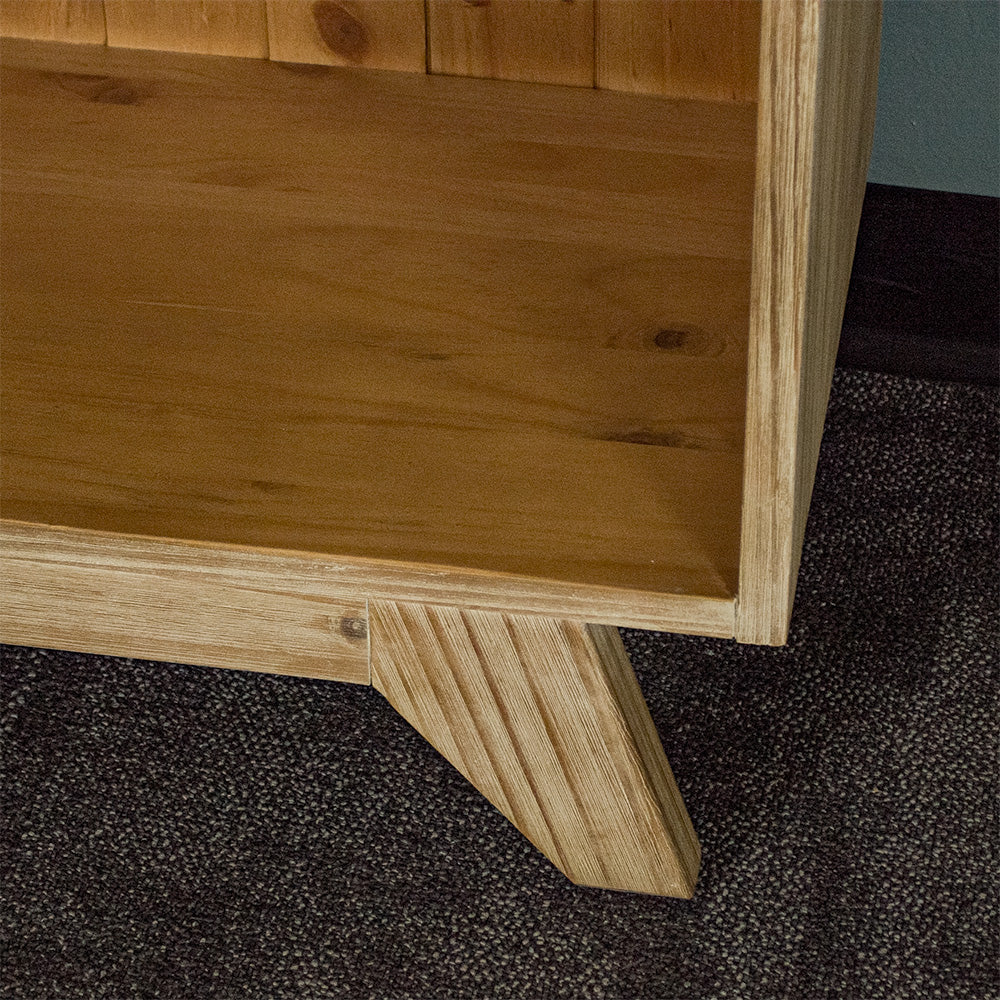 A close up of the legs on the Soho Tall Bookcase.