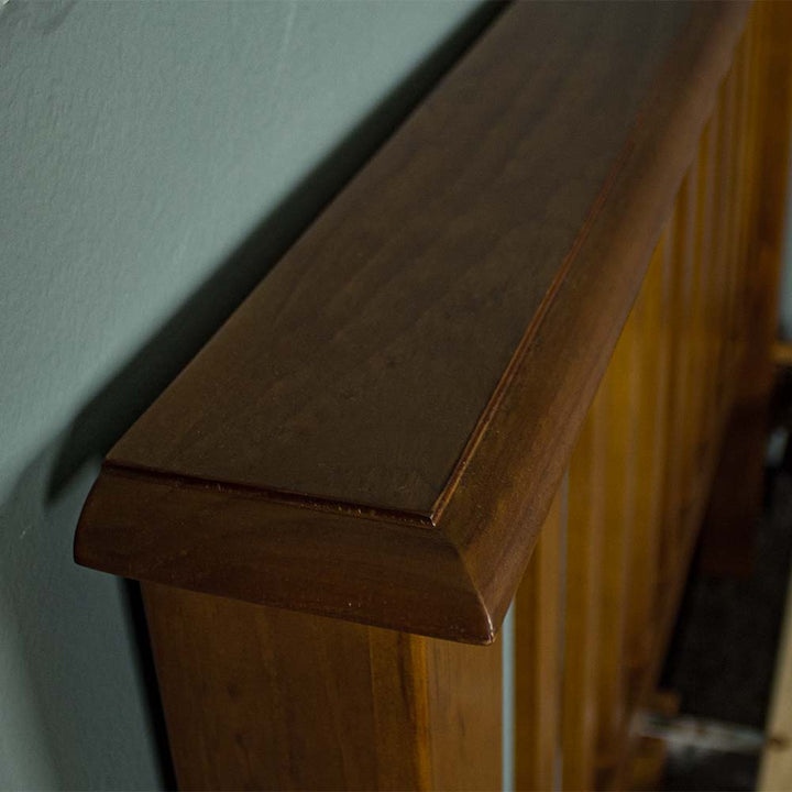 A close up of the top of the Trent Queen Size NZ Pine Slat Bed Frame, showing the wood grain and colour.