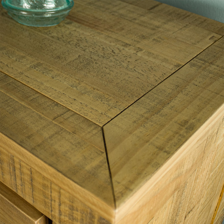 A close up of the top of the Amarillo Seven-Drawer Tallboy, showing the wood grain and colour.