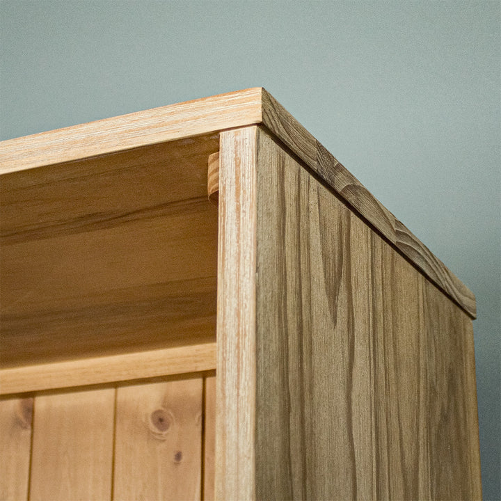 A close view of the top and side of the Soho Tall Bookcase, showing the wood grain and colour.