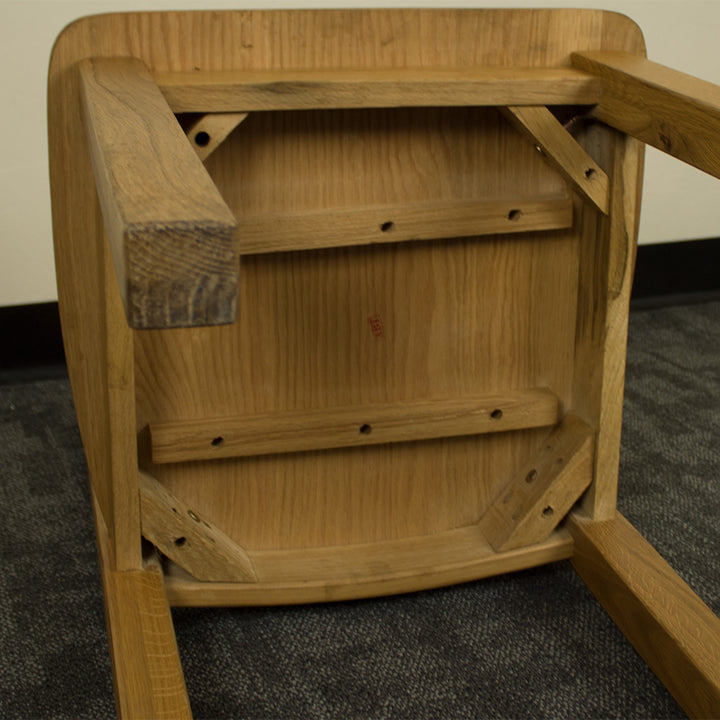 A view of the underside of the Maximus Oak Dining Chair