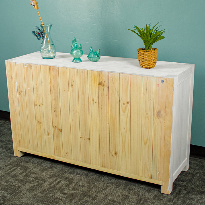 The tongue and groove back panelling of the Vancouver 7 Drawer White Lowboy.